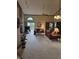 Large living room featuring fireplace, vaulted ceilings, and access to the outdoor deck at 8055 Foxchase Dr, Indianapolis, IN 46256