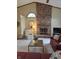 Spacious living room featuring a fireplace, vaulted ceilings, and lots of natural light at 8055 Foxchase Dr, Indianapolis, IN 46256