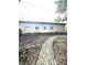 A long brick path leads to a block garage at 866 Fletcher Ave, Indianapolis, IN 46203
