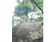 A large backyard with mature trees and a privacy fence at 866 Fletcher Ave, Indianapolis, IN 46203