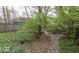 Grassy backyard features landscaped grounds and stone pathway at 866 Fletcher Ave, Indianapolis, IN 46203