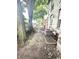 The backyard features large trees, fence and AC unit near the home at 866 Fletcher Ave, Indianapolis, IN 46203