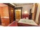 Ornate bathroom with jacuzzi tub and large glass-enclosed shower, with red accent tiles at 866 Fletcher Ave, Indianapolis, IN 46203