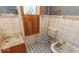 Vintage bathroom with tiled floor, pedestal sink, and classic fixtures at 866 Fletcher Ave, Indianapolis, IN 46203