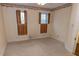 Neutral bedroom with light-colored walls, wood shutters, and carpet at 866 Fletcher Ave, Indianapolis, IN 46203