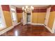 Dining room featuring hardwood floors, a vintage chandelier and period-appropriate paint at 866 Fletcher Ave, Indianapolis, IN 46203