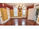 Dining room with hardwood flooring, chandelier, and original woodwork at 866 Fletcher Ave, Indianapolis, IN 46203