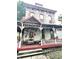 Vintage home showcasing intricate architectural details and a spacious front porch at 866 Fletcher Ave, Indianapolis, IN 46203