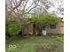 Detached garage with stone facade and mature trees at 866 Fletcher Ave, Indianapolis, IN 46203