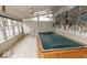 Indoor pool with ample natural light and muraled accent wall. The pool is currently covered at 866 Fletcher Ave, Indianapolis, IN 46203