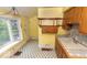 Sunny kitchen area features tile floors, double sink, and window at 866 Fletcher Ave, Indianapolis, IN 46203