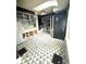 A contemporary kitchen with stainless steel appliances, modern cabinets, and stylish tile flooring at 866 Fletcher Ave, Indianapolis, IN 46203