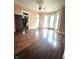 An open living room with large windows offers plenty of natural light and hardwood floors at 866 Fletcher Ave, Indianapolis, IN 46203