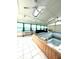 Indoor pool area with a partially filled pool and natural light from skylights at 866 Fletcher Ave, Indianapolis, IN 46203
