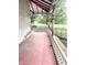 Side porch featuring classic railings and a concrete floor at 866 Fletcher Ave, Indianapolis, IN 46203