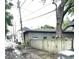 A street view of the backyard of the home with a view of powerlines at 866 Fletcher Ave, Indianapolis, IN 46203