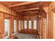 Wood paneled sunroom with multiple windows and an oriental rug at 866 Fletcher Ave, Indianapolis, IN 46203