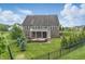 Expansive backyard with fire pit, deck, and beautiful landscaping at 902 Racetime Rd, Westfield, IN 46074
