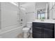 Clean, bright bathroom with a tub-shower combo, toilet, and vanity with dark wood cabinets at 902 Racetime Rd, Westfield, IN 46074