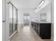 A primary bathroom showcasing the dual vanity with granite countertop, tub and glass shower at 902 Racetime Rd, Westfield, IN 46074