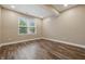 Inviting bedroom features wood floors and a sunlit window at 902 Racetime Rd, Westfield, IN 46074