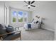 Inviting bedroom with large windows, plush carpet, and stylish, comfortable furnishings at 902 Racetime Rd, Westfield, IN 46074