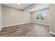 Spacious bedroom features hardwood floors and natural light from a large window at 902 Racetime Rd, Westfield, IN 46074