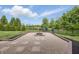 Beautiful outdoor fire pit area with stone pavers and black mulch at 902 Racetime Rd, Westfield, IN 46074