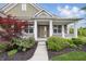 Charming brick home featuring a covered front porch with classic white columns and inviting curb appeal at 902 Racetime Rd, Westfield, IN 46074