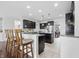 Spacious kitchen with dark cabinetry, granite countertops, and a convenient breakfast bar at 902 Racetime Rd, Westfield, IN 46074