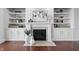 Elegant living room fireplace featuring built-in shelves and decorative accents for a cozy ambiance at 902 Racetime Rd, Westfield, IN 46074