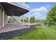 Covered patio with fire pit feature and well-manicured landscaping at 902 Racetime Rd, Westfield, IN 46074