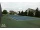 Well-maintained community tennis court surrounded by lush trees at 902 Racetime Rd, Westfield, IN 46074