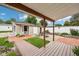 Inviting backyard with a covered patio, fire pit, and charming shed at 910 E Pike St, Martinsville, IN 46151