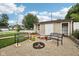 Relaxing backyard with a fire pit, benches, and a shed at 910 E Pike St, Martinsville, IN 46151
