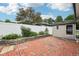 Brick patio and manicured landscaping in a fenced backyard at 910 E Pike St, Martinsville, IN 46151