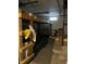 Unfinished basement with storage shelving and a small window for natural light at 910 E Pike St, Martinsville, IN 46151