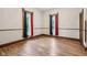 Traditional bedroom with hardwood floors, vintage trim, and well-lit windows at 910 E Pike St, Martinsville, IN 46151