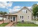 Beautiful home exterior with a covered porch and a well-maintained lawn at 910 E Pike St, Martinsville, IN 46151