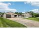 Charming home with a detached garage and a long driveway at 910 E Pike St, Martinsville, IN 46151
