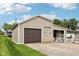 Detached garage with a 'Welcome' sign and ample parking space at 910 E Pike St, Martinsville, IN 46151