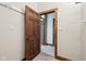 Hallway showcasing a doorway with wood trim details and additional doorways beyond at 910 E Pike St, Martinsville, IN 46151