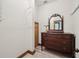 Hallway featuring a vintage dresser with mirror, offering both storage and classic charm at 910 E Pike St, Martinsville, IN 46151