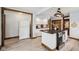 Kitchen featuring white cabinets, granite countertops, stainless steel appliances, and wood-look floors at 910 E Pike St, Martinsville, IN 46151