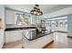 Stylish eat-in kitchen featuring granite countertops, white cabinets, and stainless steel appliances at 910 E Pike St, Martinsville, IN 46151