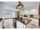 Lovely kitchen with granite countertops, stainless steel appliances, a gas range, and lots of natural light at 910 E Pike St, Martinsville, IN 46151