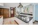 Beautiful kitchen with granite countertops, stainless steel appliances, white cabinets, and wood floors at 910 E Pike St, Martinsville, IN 46151