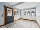Inviting sun room with exterior door, multiple windows, and wood trim accents at 910 E Pike St, Martinsville, IN 46151
