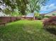 Backyard with wooden deck, shed, and plenty of green space for outdoor activities and entertaining at 9134 Jene Ct, Indianapolis, IN 46234