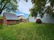Backyard with wooden deck, shed, and plenty of green space for outdoor activities and entertaining at 9134 Jene Ct, Indianapolis, IN 46234